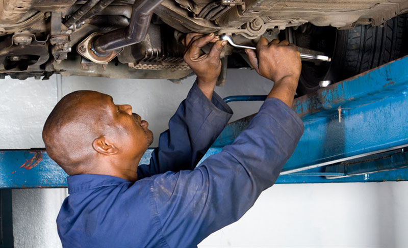 mechanic repairing vehicle