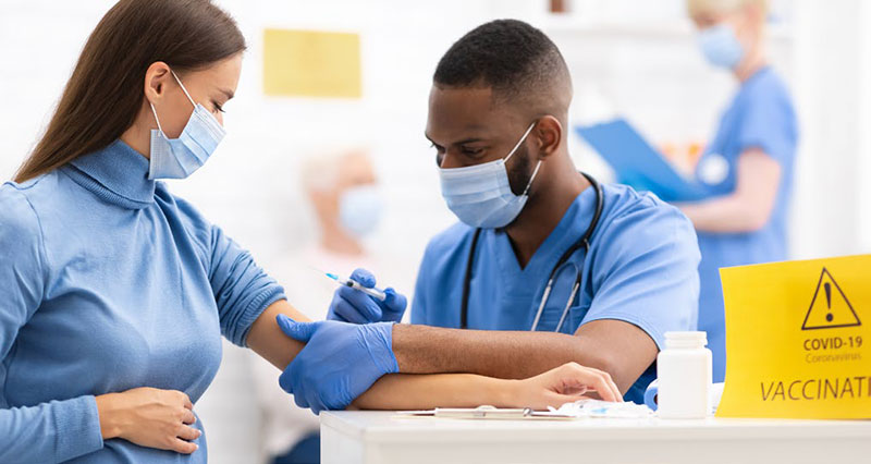 lady receiving COVID vaccine