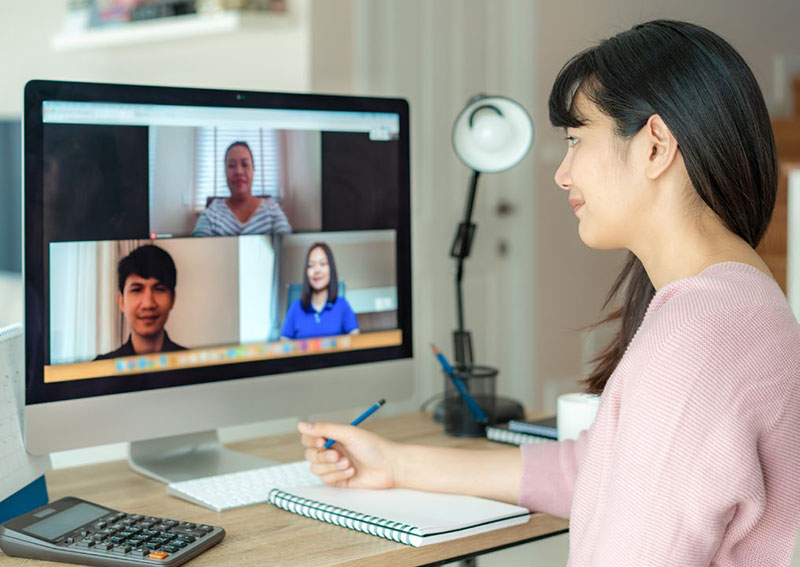 employee talking to colleagues in video conference