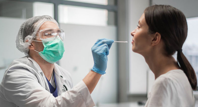 woman having her nose swabbed