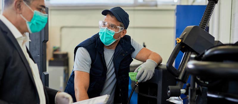 two men wearing face masks