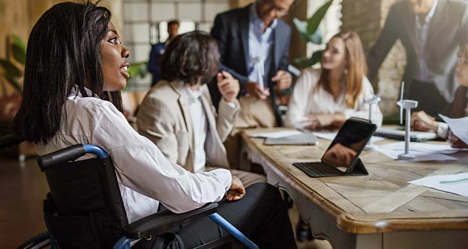 woman in wheelchair at meeting