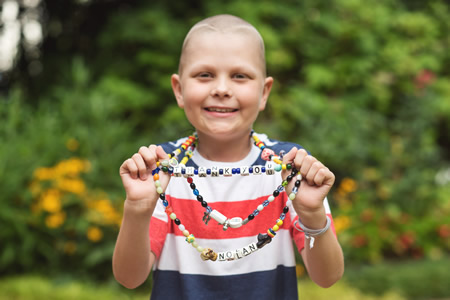 child wearing Beads of Courage