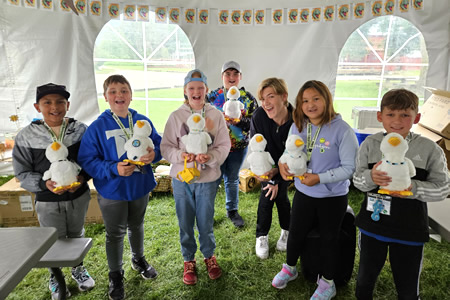 children posing with Aflac ducks