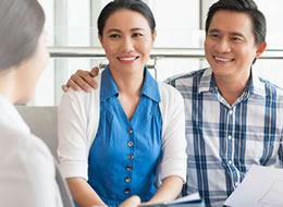 man and woman having a discussion with a doctor