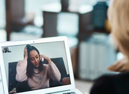 woman using a laptop for a webex