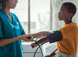 woman getting blood pressure taken