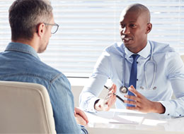 man talking with doctor