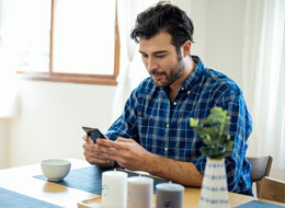 man playing on cellphone