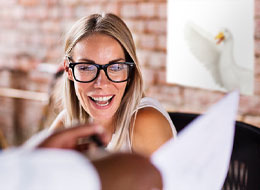 woman being handed piece of paper