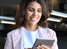 woman looking at tablet