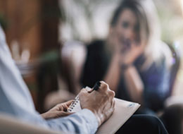 woman talking with therapist