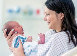 newborn in mothers lap