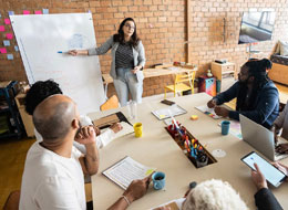 woman teaching a group of people