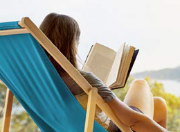 woman sitting in beach chair