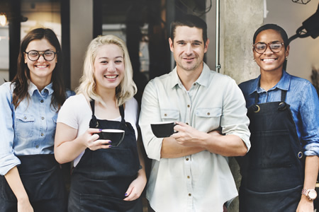 coffees shop employees posing for photo