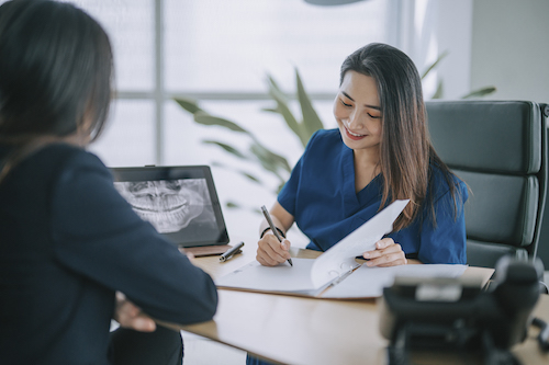 Woman signing papers