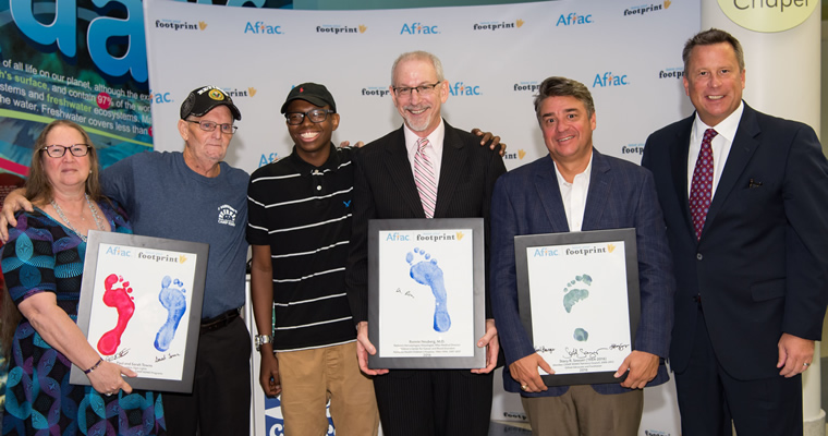 people pose with their Aflac Footprints awards