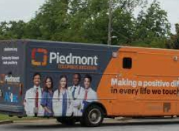 Aflac branded mobile health care bus