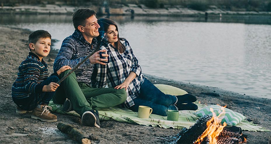 Family camping by a lake.