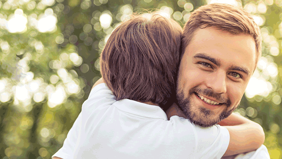 Father and his son hugging.