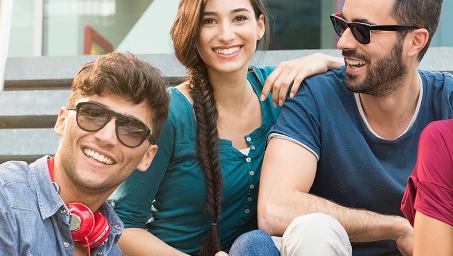 group of three people smiling