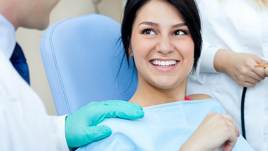 woman in dentist's chair about to have her teeth cleaned