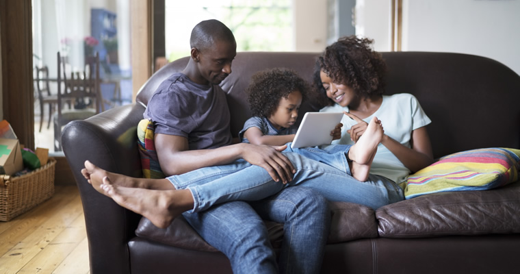 family looking at tablet