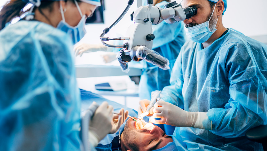 dentist performing oral surgery