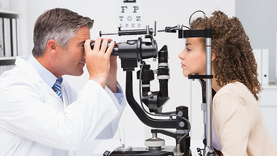 optometrist conducting an eye exam