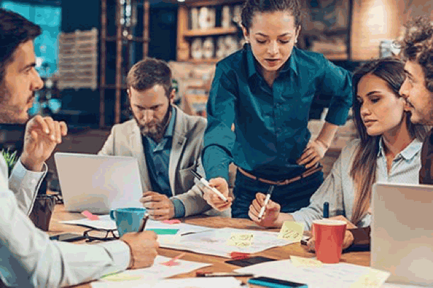 Professionals work on finding the right health insurance plan in the workplace