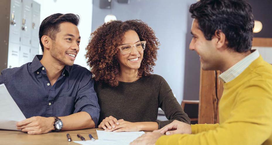 three people sitting at a table