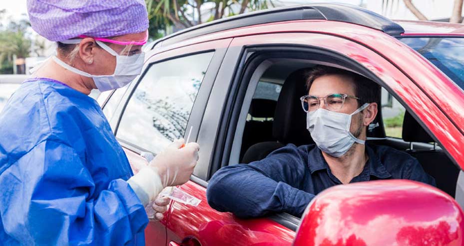 man at drive thru test site