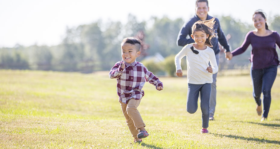 children playing tag in the park