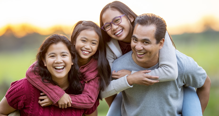 husband and wife with two daughters