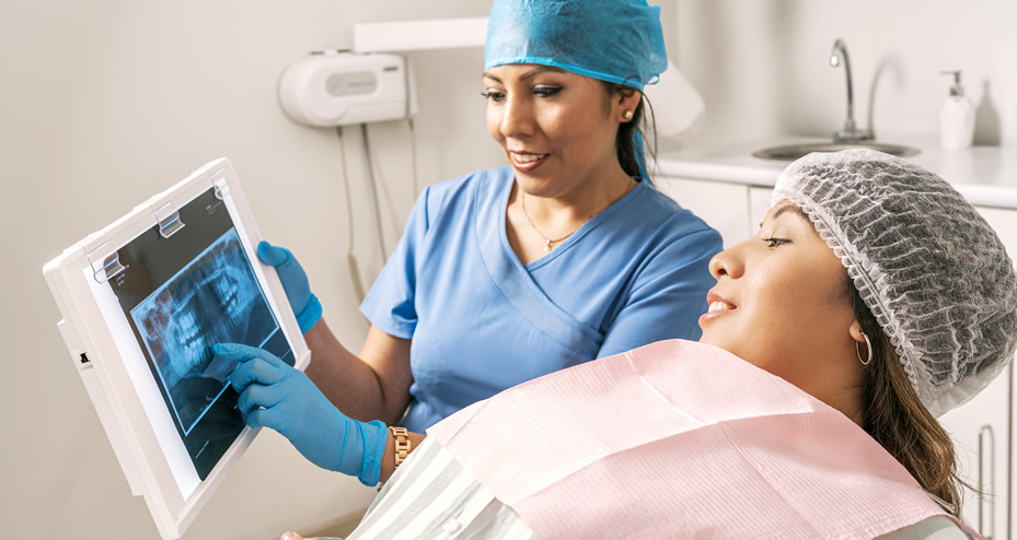 dentist talking to a patient about a dental incident