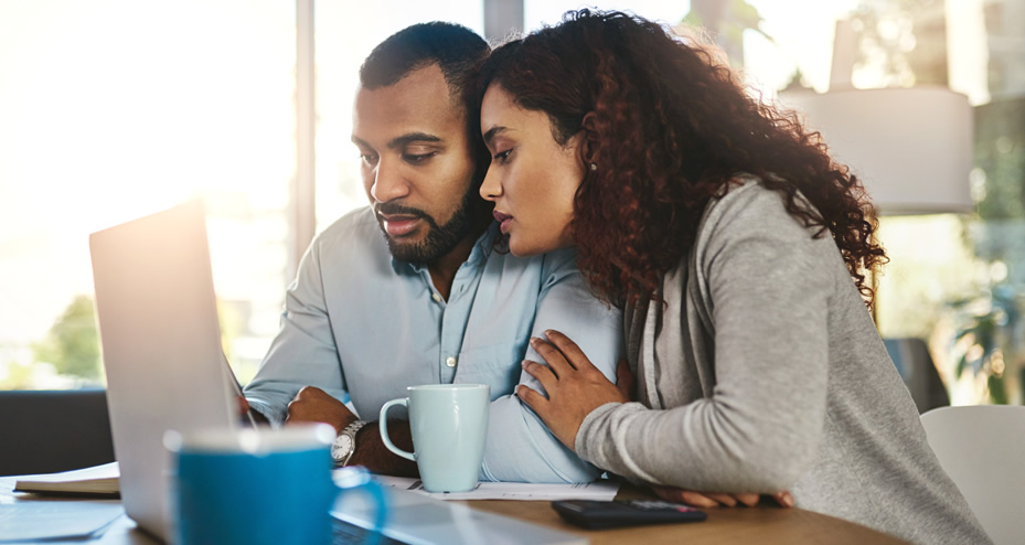 couple looking at a laptop computer