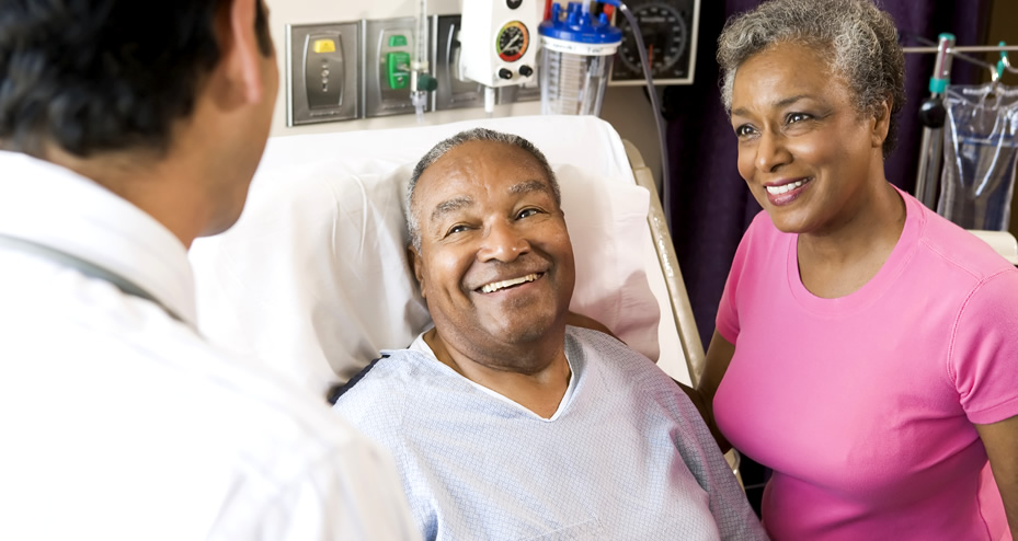 couple in hospital talking to a doctor