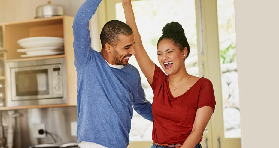 couple dancing in the kitchen