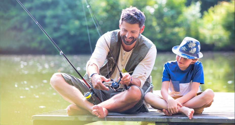 father and son fishing on a dock