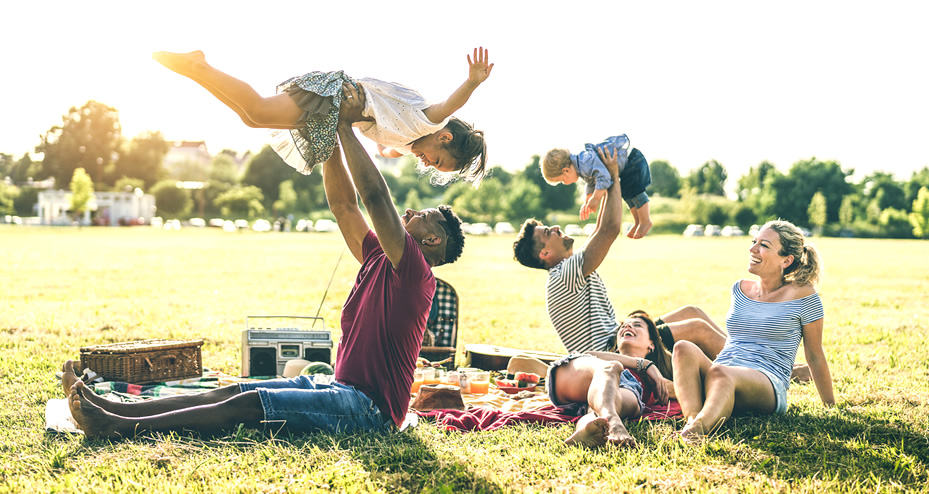 two families having a picnic in a park