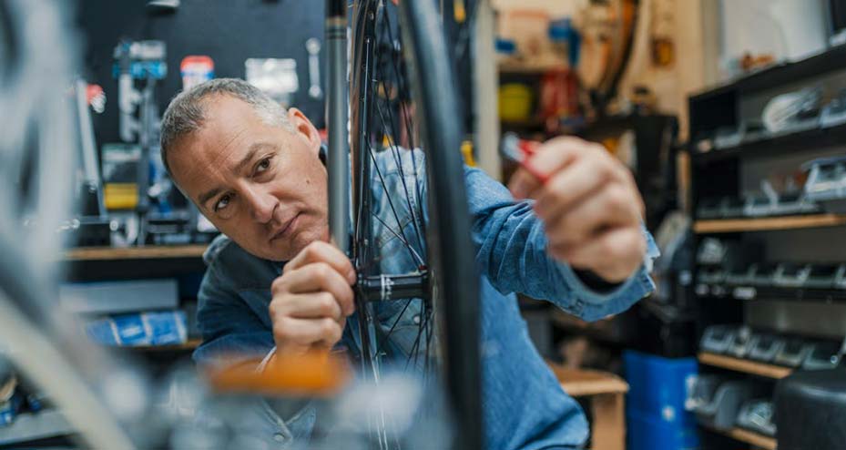 man working on bike