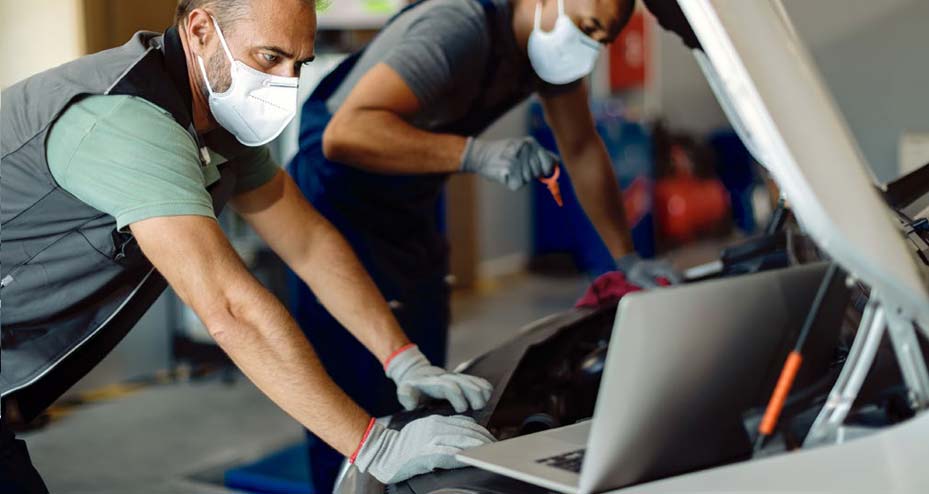 mechanic looking at laptop