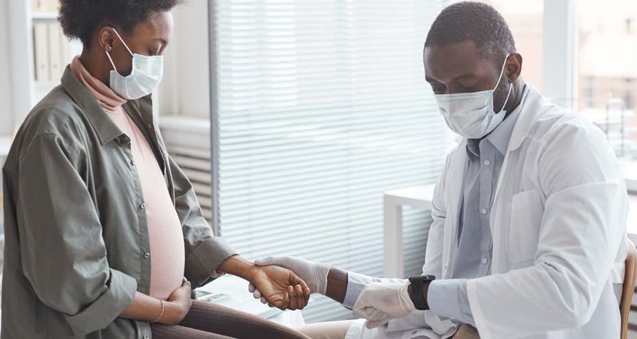 doctor checking patients heart rate