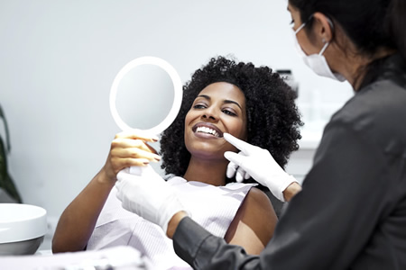 dental hygienist talking with patient